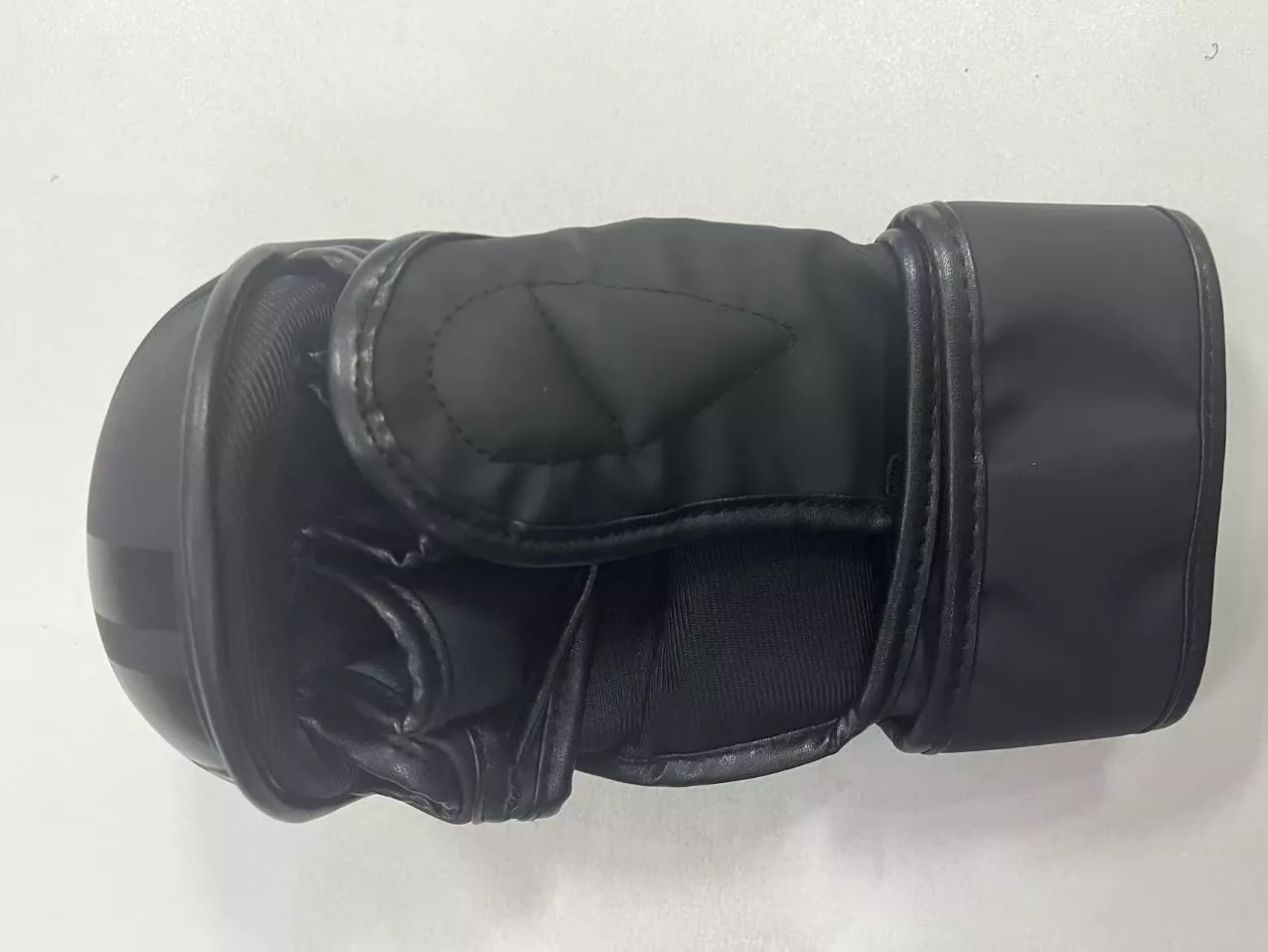 MMA gloves with semi-open finger design and knuckle padding