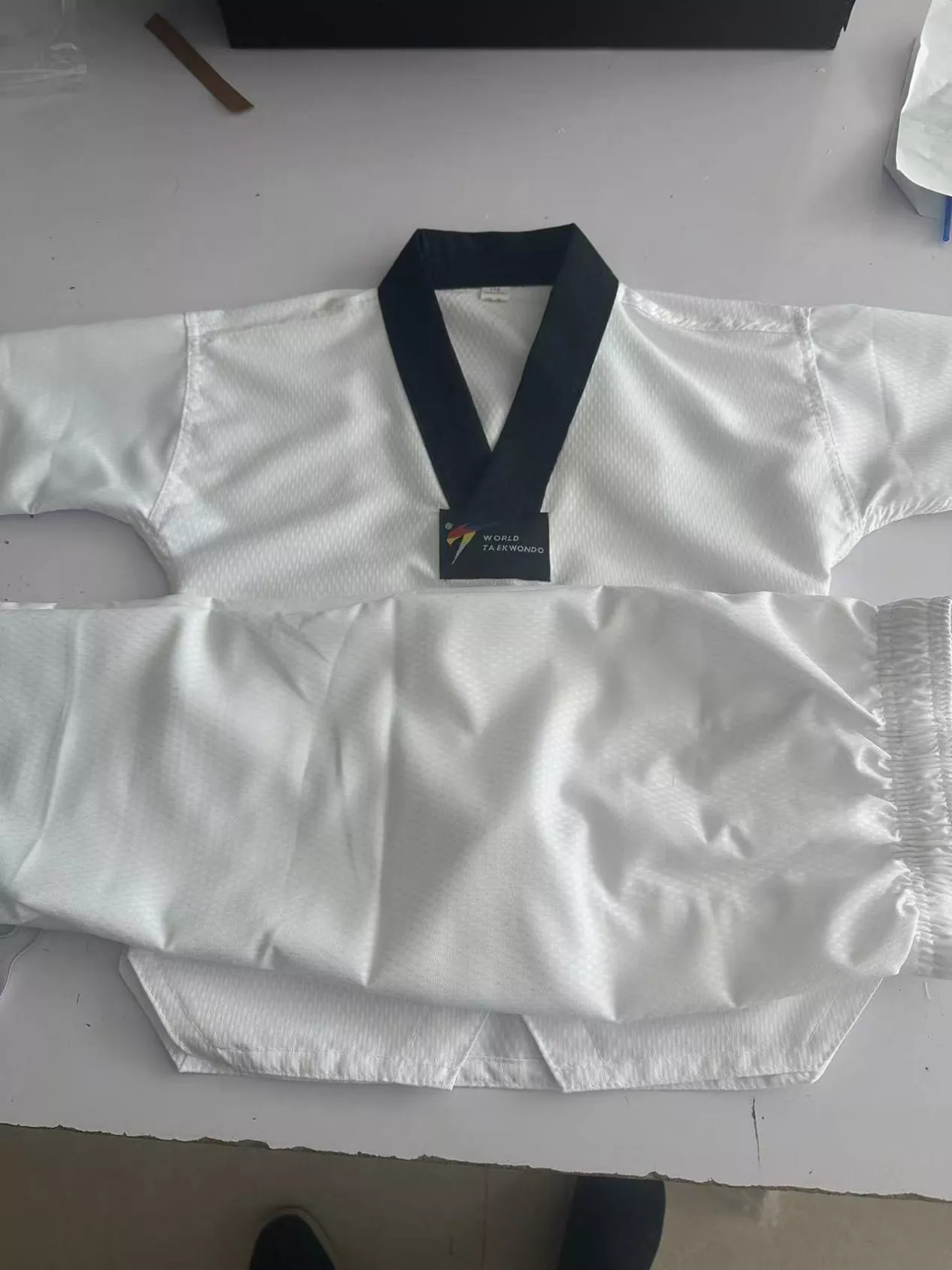 Taekwondo students wearing PandaWin Sports uniforms during real training session